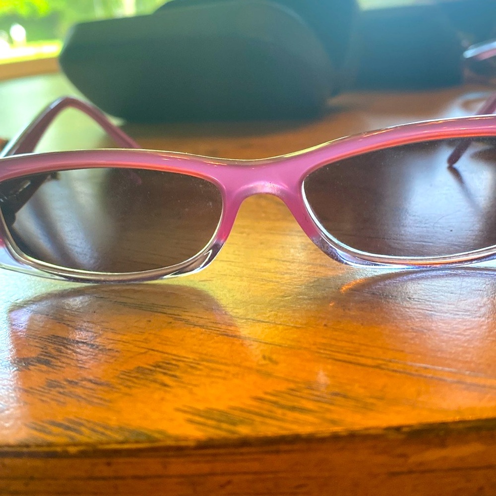 Versus glasses. Pretty purple frame. No prescription lens.